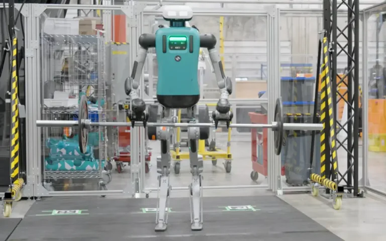 humanoid industrial robot lifting a barbell with weighted plates in a testing facility min 768x480