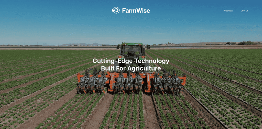- RobotsInc.com Green tractor with an orange implement works a cultivated field under a clear blue sky, with the slogan 'Cutting-Edge Technology Built For Agriculture' in the center.