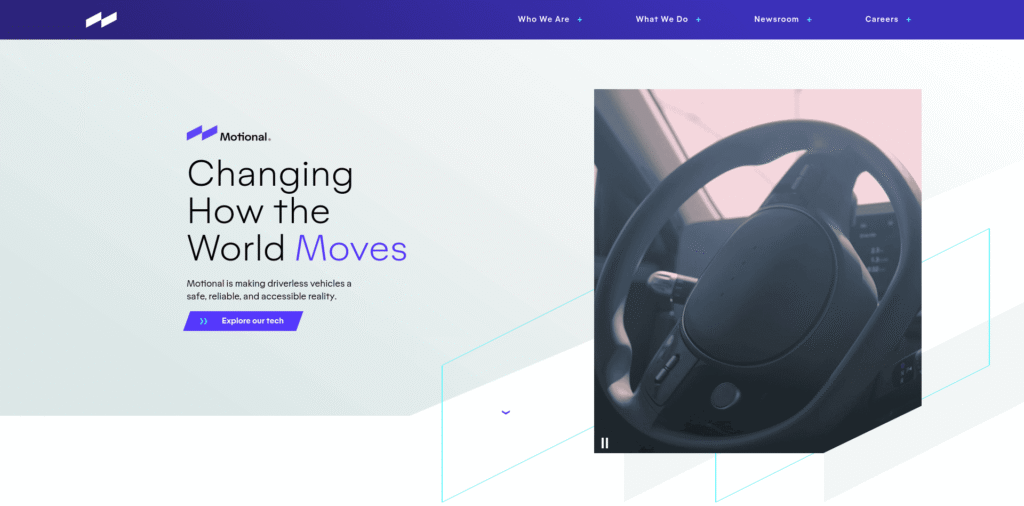 - RobotsInc.com Hero banner for Motional: large headline 'Changing How the World Moves' with 'Explore our tech' CTA; right shows a car steering wheel video thumbnail.