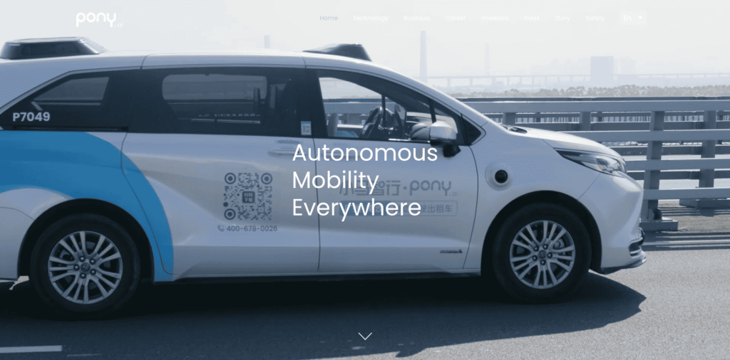 - RobotsInc.com Autonomous taxi parked on a bridge with the overlay text 'Autonomous Mobility Everywhere'.