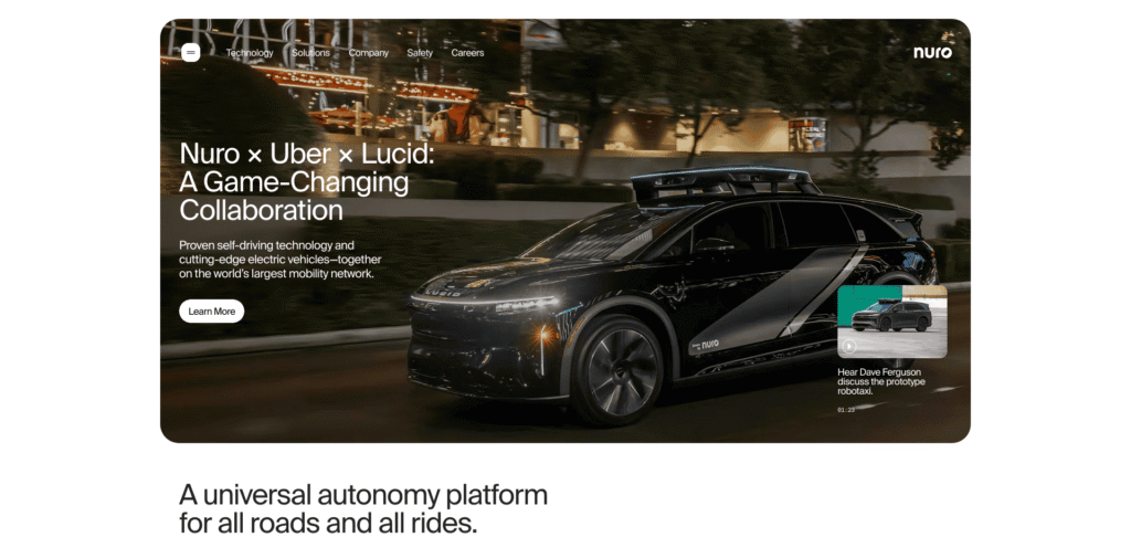 - RobotsInc.com Autonomous Nuro car with Uber and Lucid branding driving at night, overlaid with a collaboration headline and Learn More CTA