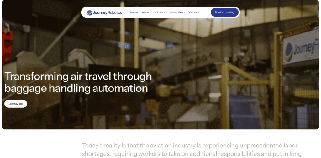 - RobotsInc.com Industrial baggage handling facility as a hero image with the tagline 'Transforming air travel through baggage handling automation.'