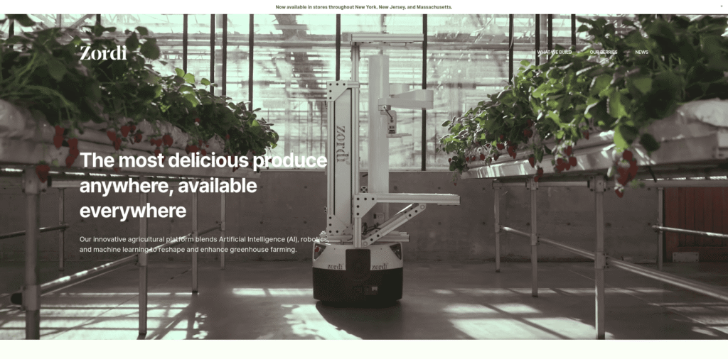 - RobotsInc.com Robotic farming system in a greenhouse among strawberry plants; bold headline reads 'The most delicious produce anywhere, available everywhere'.