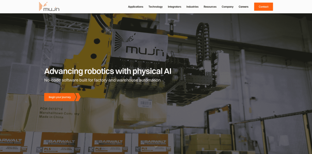 - RobotsInc.com Industrial robot arm operating in a warehouse among stacked boxes, conveying advanced robotics and physical AI