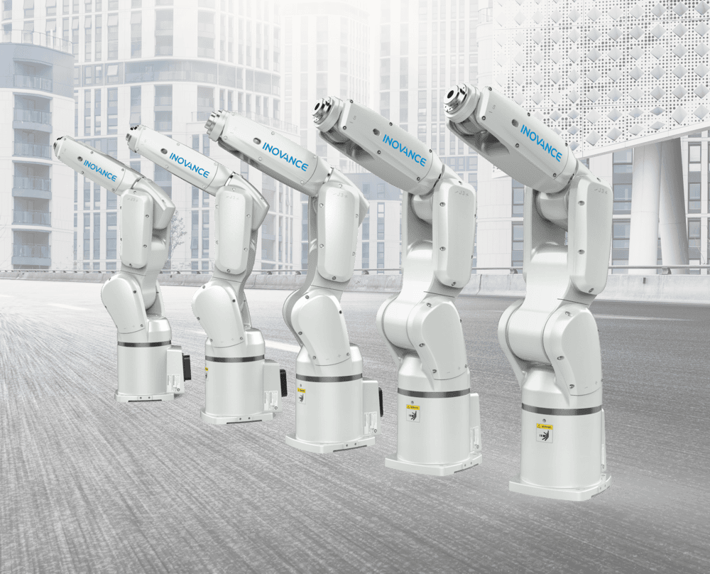 - RobotsInc.com Five white industrial robotic arms on a rooftop, labeled INOVANCE, raised in a row with a cityscape in the background.