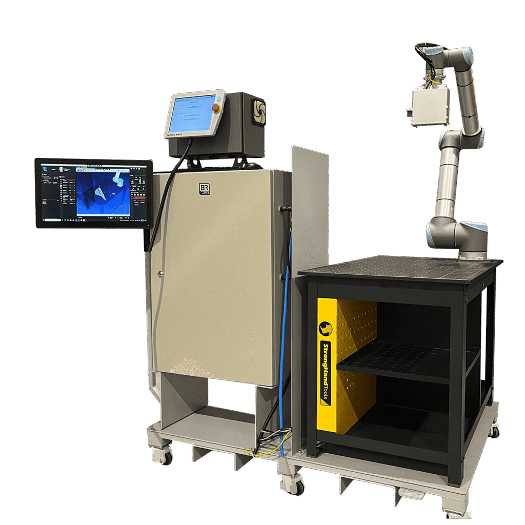 » RobotsInc.com Industrial robotic arm with a control console and monitor attached to a large processing cabinet, mounted on a mobile cart with a worktable and safety yellow panels nearby for automation tasks
