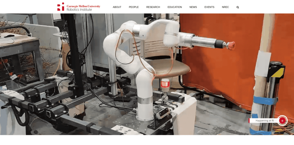 - RobotsInc.com Robotic arm mounted on a lab bench with cables and a chair in the background, in a roboticsç ”ç©¶ workspace
