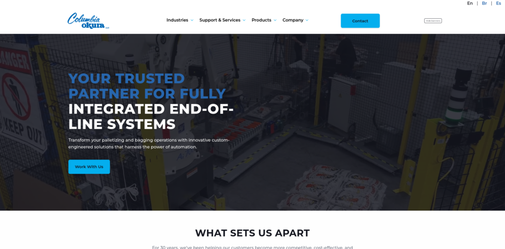 - RobotsInc.com Hero banner of an automated packaging line with bold blue headline about integrated end-of-line systems and a 'Work With Us' button on the left.