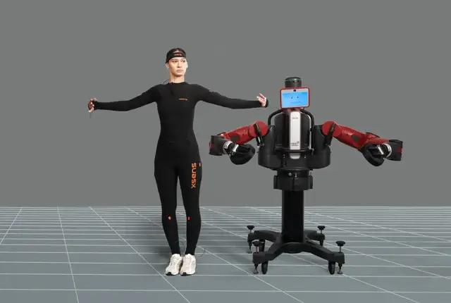 Women wearing Xsens Link suit next to a robot min